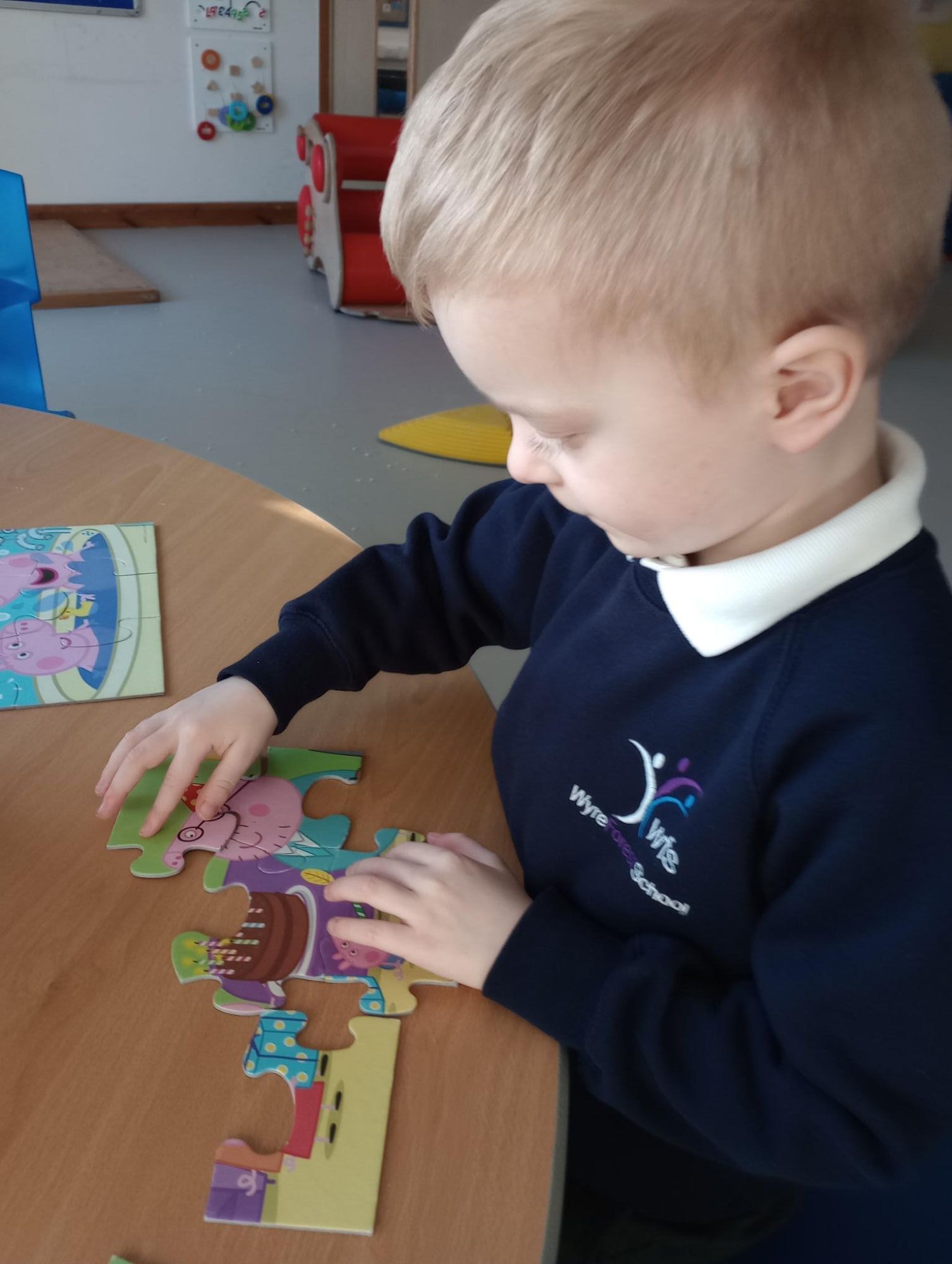 Student doing jigsaw puzzle Student doing jigsaw puzzle